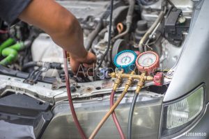 AC Repair checking refrigerant pressure
